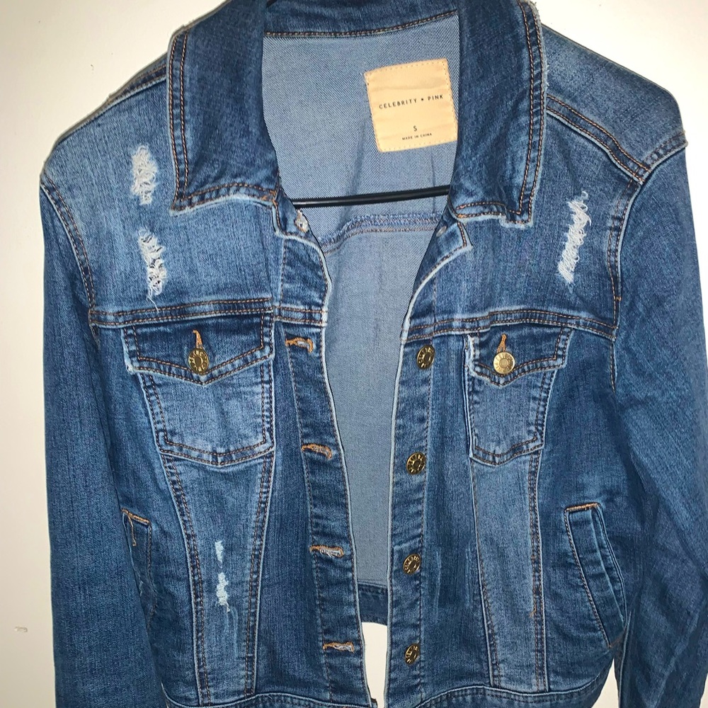 In good condition, distressed jean jacket